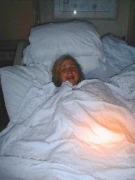 Sue right after the birth. Note the surgical lights on the sheet.