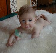 Nekid' Baby on a Rug